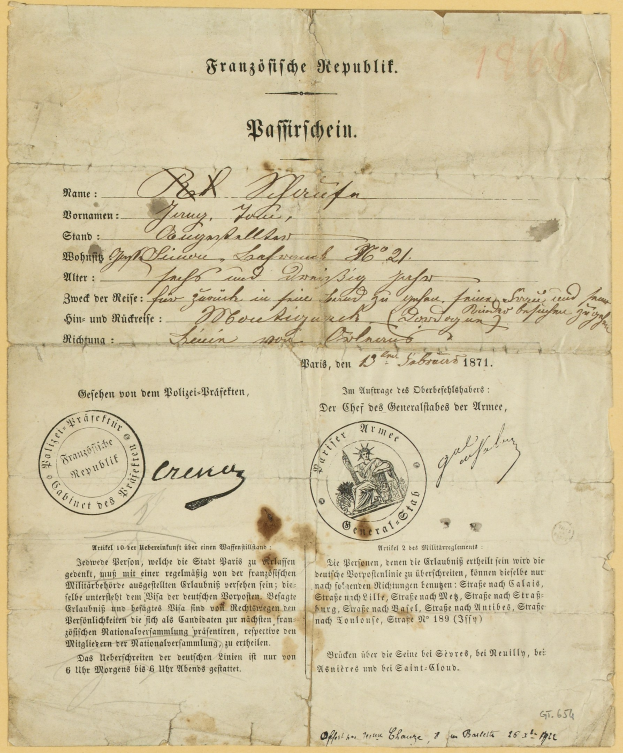 Altes deutsches Regierungsdokument mit einem kreisförmigen schwarz umrandeten Stempel auf gelbem Papier.