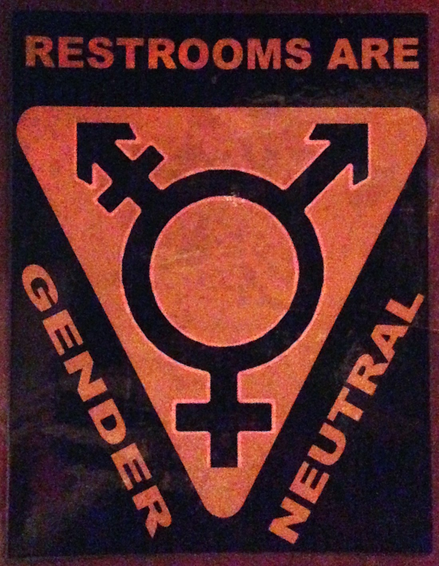 Plakat mit dem Text 'Toiletten sind geschlechterneutral' betont die Geschlechterinklusivität in Toiletten.