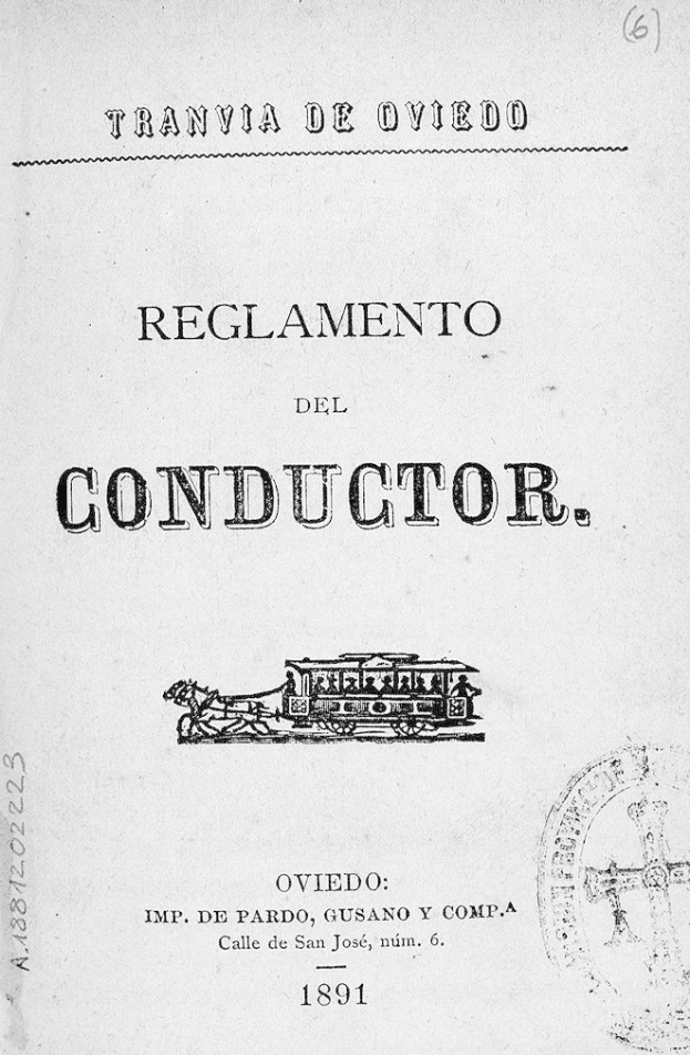 Schwarz-weißes Bild eines alten Buches mit dem Titel "Reglamento de Conductor" und einer Zeichnung eines Zuges auf dem Cover und einem Stempel auf der rechten Seite.
